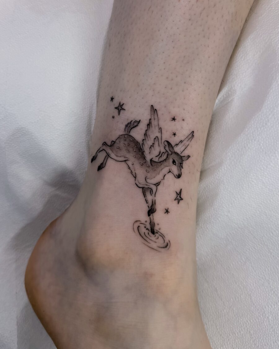 Magical unicorn tattoo with playful details Tattoo on skin