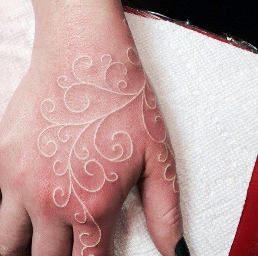 Accessorize Without the Flashy Jewelry on this White Ink Tattoo Tattoo on skin