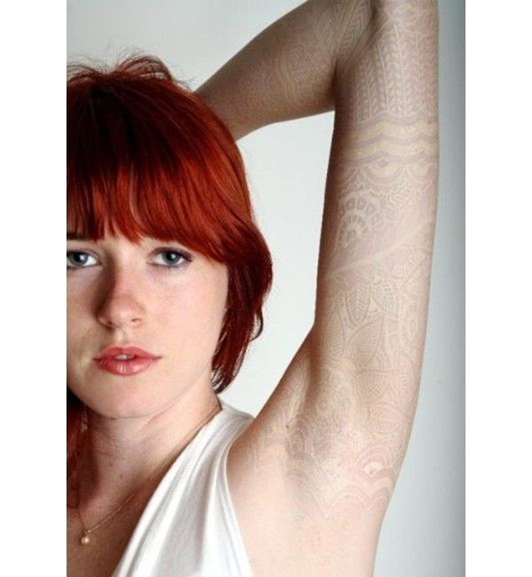 Celebrating Wealth and Delicacies in Lace White Ink Tattoo Tattoo on skin