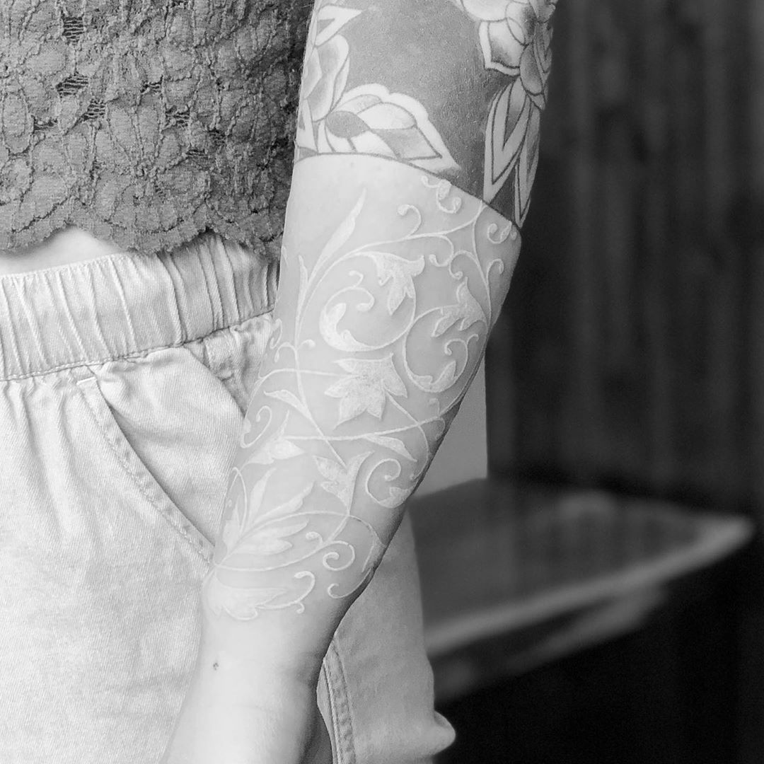 Delicate Lace Flourishes on the Skin White Ink Tattoo Tattoo on skin