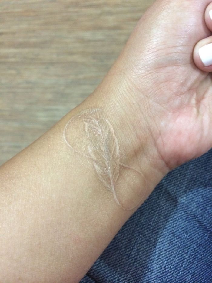 Floating Flower Tattoo with Infinity Symbol White Ink Tattoo Tattoo on skin