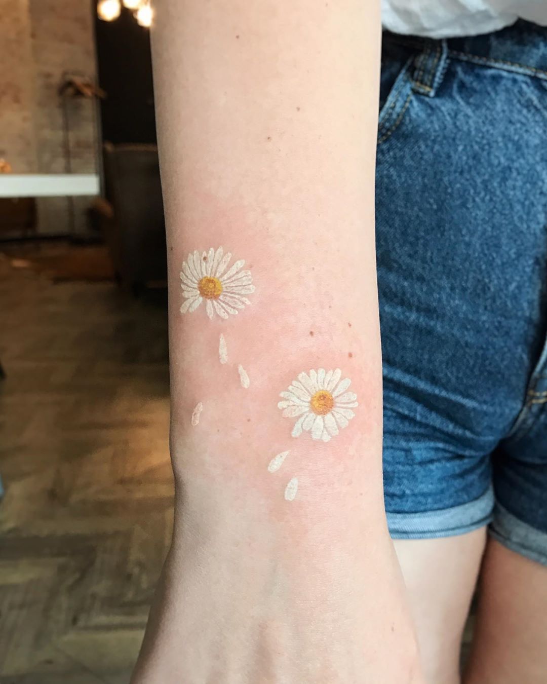 He Loves Me. He Loves Me Not. White Ink Tattoo Tattoo on skin