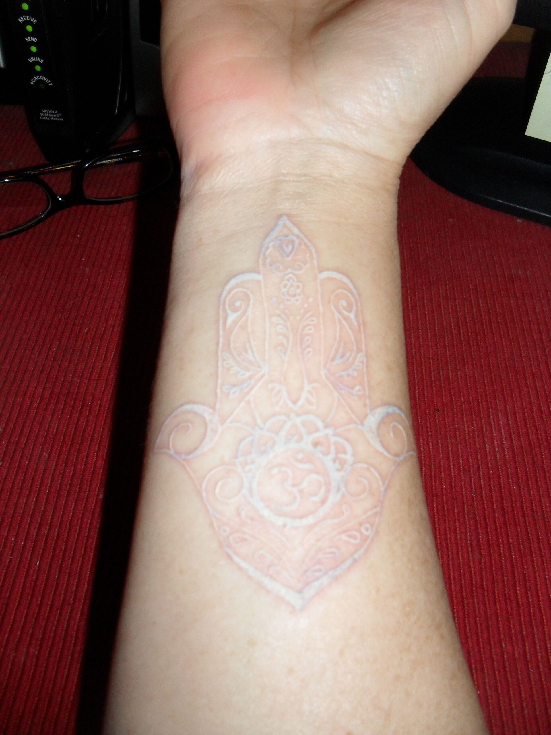 Honor For Creation with Om White Ink Tattoo Tattoo on skin