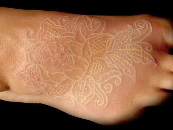 Intricate and Elegant Floral Placement White Ink Tattoo Tattoo on skin