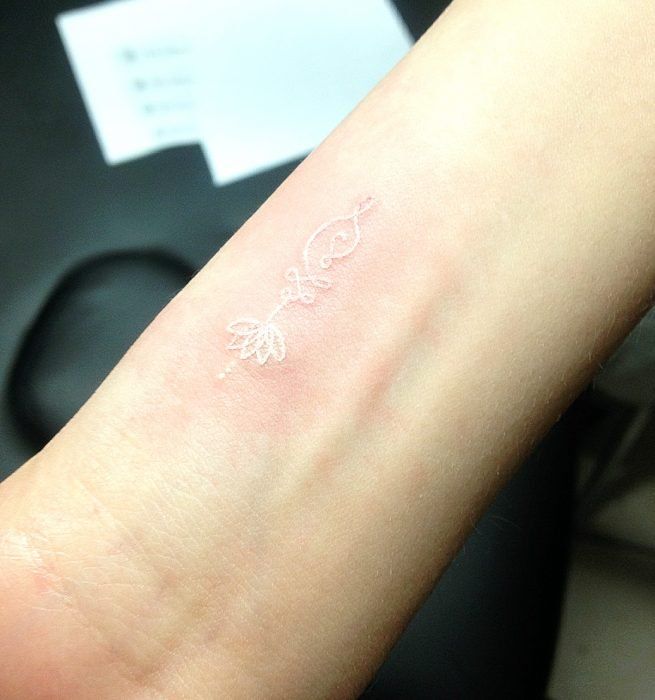 Minimal White Ink Tattoo Tattoo on skin