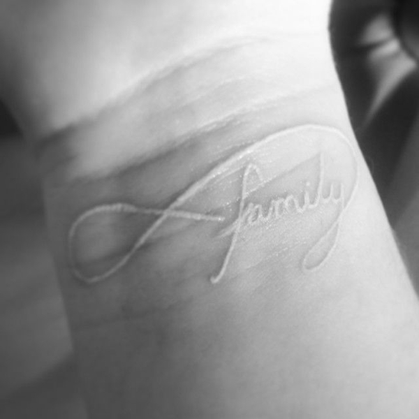 Modern Take on White Ink Tattoo of Family Tattoo on skin