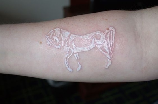 Power and Strength of a Tribal Horse White Ink Tattoo Tattoo on skin