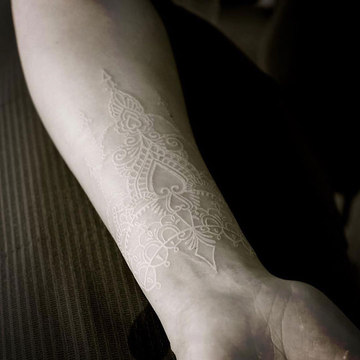 Sticking With Tradition and Making it Permanent White Ink Tattoo Tattoo on skin