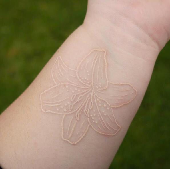 The Colorless Lilly White Ink Tattoo Tattoo on skin