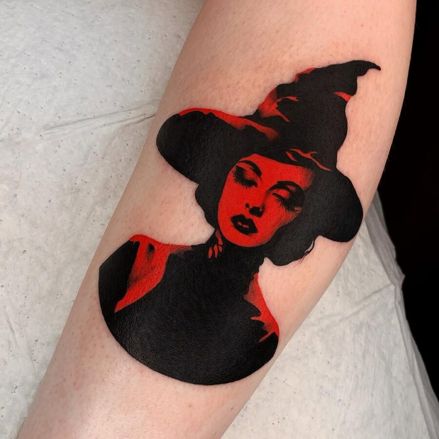 Bold witch hat tattoo with striking contrasts Tattoo on skin