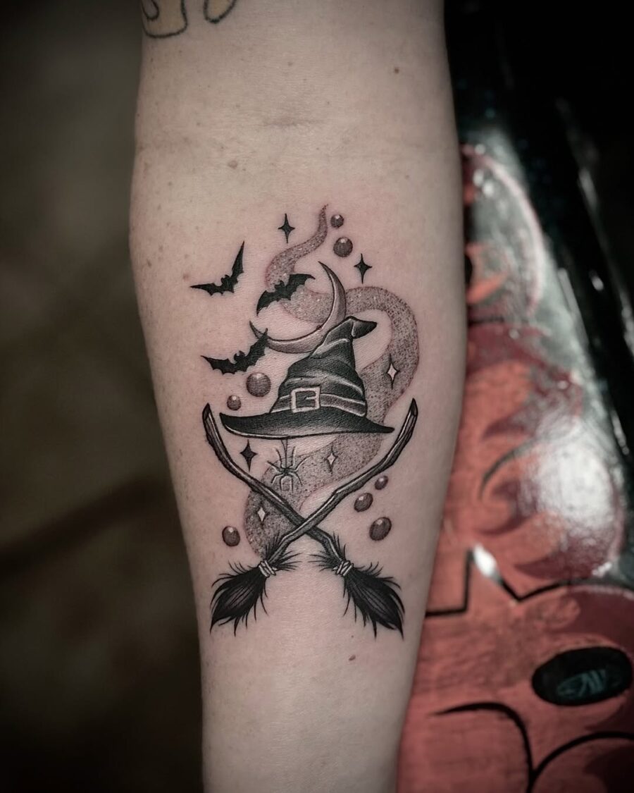 Charming witch hat tattoo with mystical elements Tattoo on skin