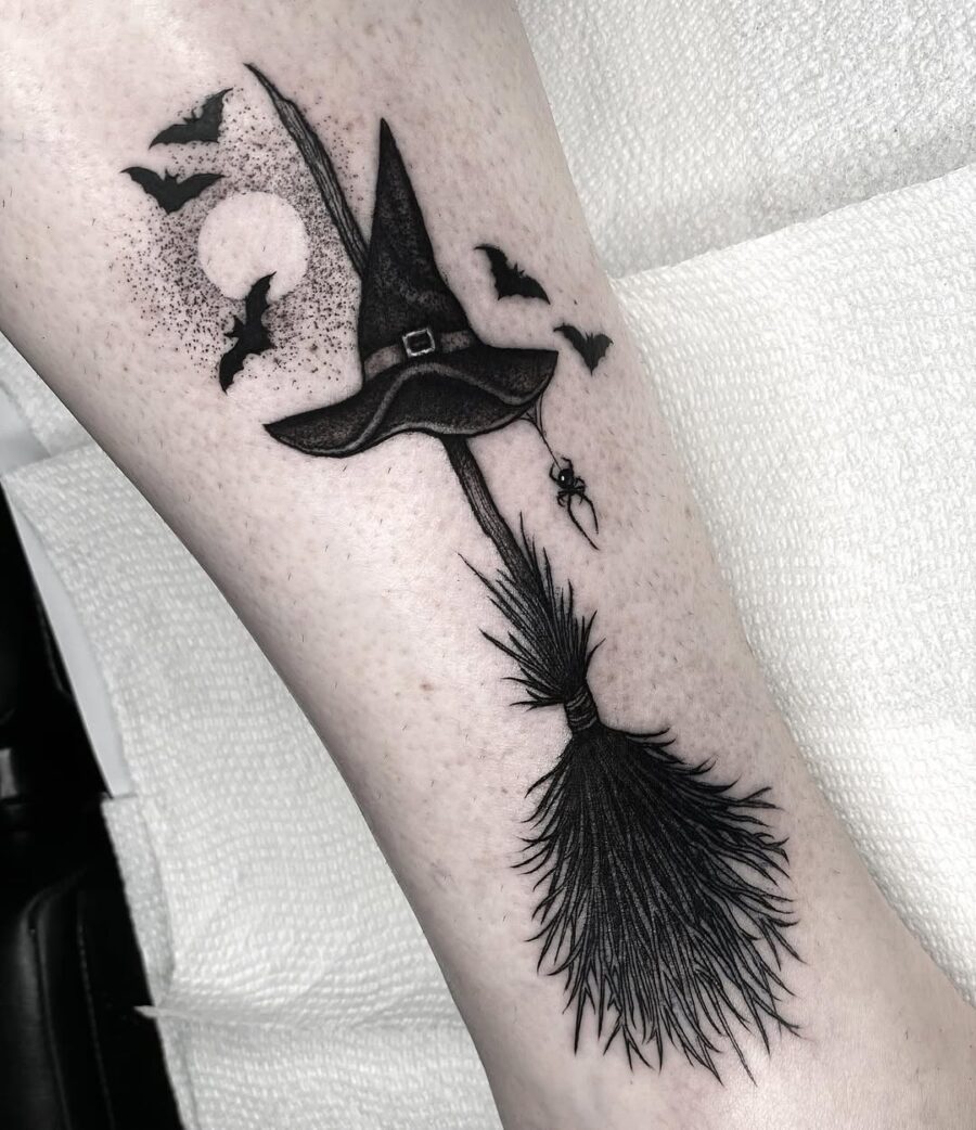 Charming witch hat tattoo with spooky elements Tattoo on skin