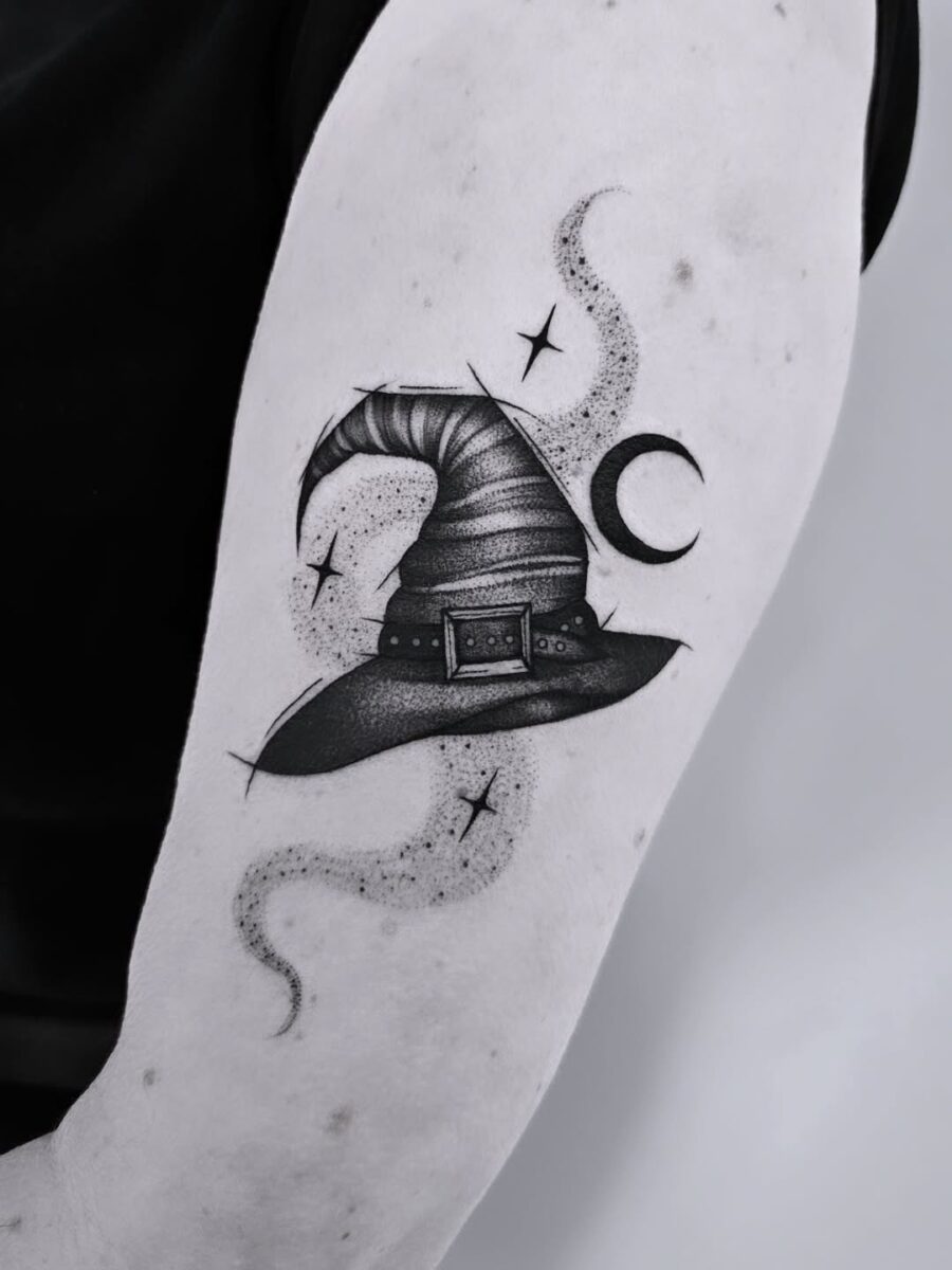 Elegant Witch Hat Tattoo with Mystical Elements Tattoo on skin