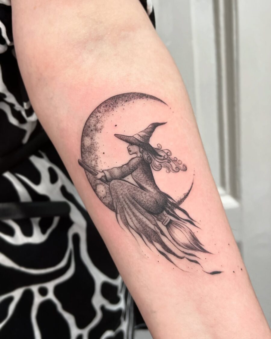 Enchanting witch flying under a crescent moon Tattoo on skin