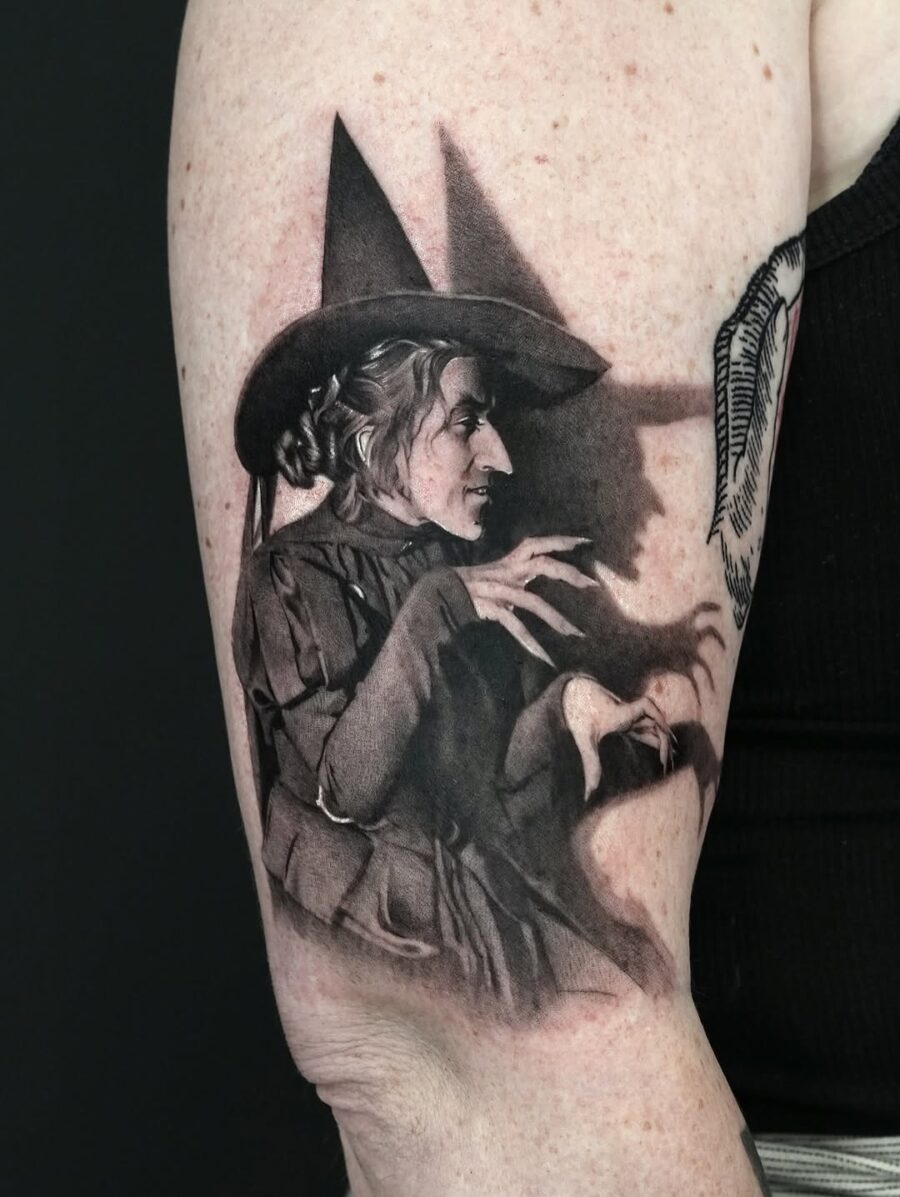 Mysterious witch portrait with iconic hat Tattoo on skin