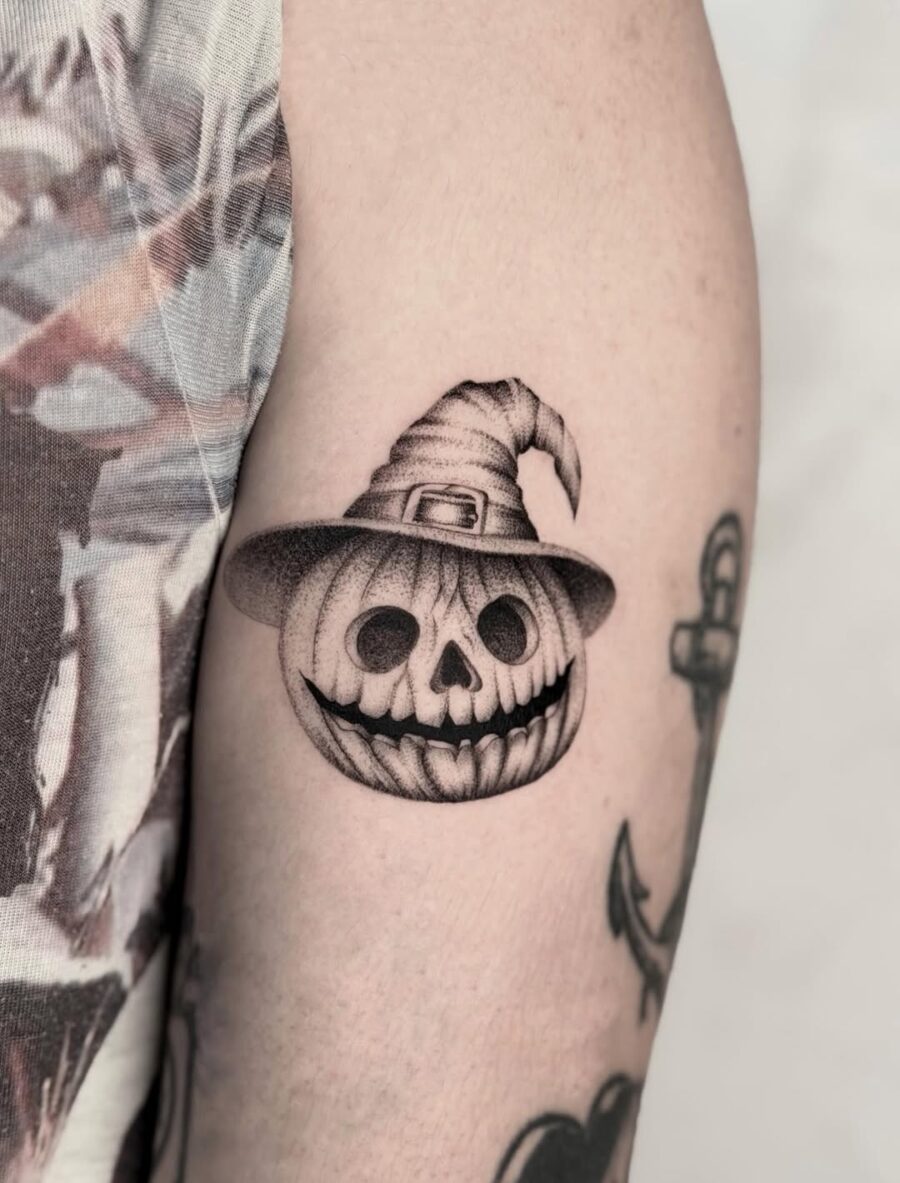 Spooky skull with witch hat design tattoo Tattoo on skin