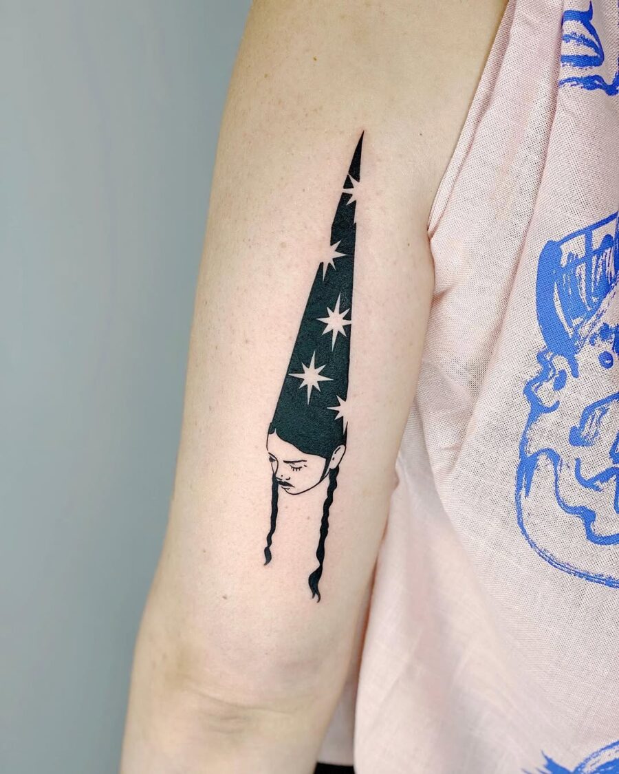 Unique witch hat tattoo with star accents Tattoo on skin