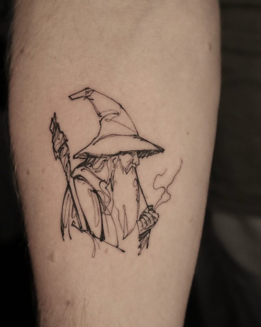 Wizardly charm captured in minimalist tattoo art Tattoo on skin