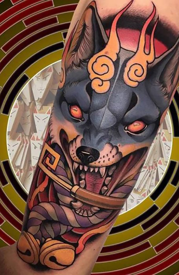 Orange-Eyed Snarling Wolf with Bells Tattoo on skin