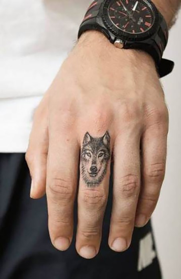 Realistic Black & White Wolf Finger Tattoo Tattoo on skin