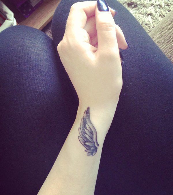 Angel's Wing wrist Tattoo on a lady's arm Tattoo on skin